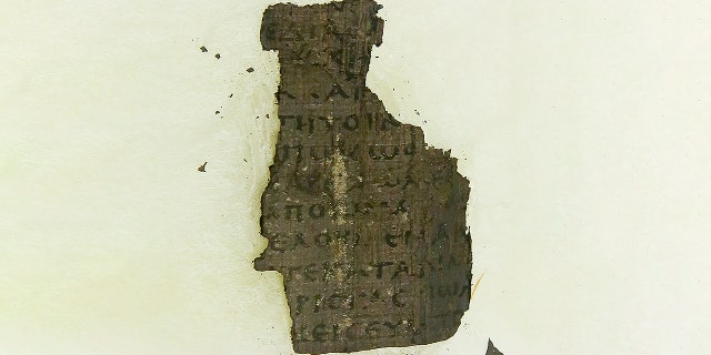 A fragment of Herculaneum scroll. Researchers have been using the UK's national synchrotron science facility, Diamond Light Source, to examine fragments of 2,000 year-old of Herculaneum scroll, owned by the Institut de France, in the hope of using the high energy X-ray beamline to decode the fragments of scrolls. (Credit: GEOFF CADDICK/AFP via Getty Images)