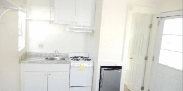 The unit comes with a small kitchenette and bathroom.
