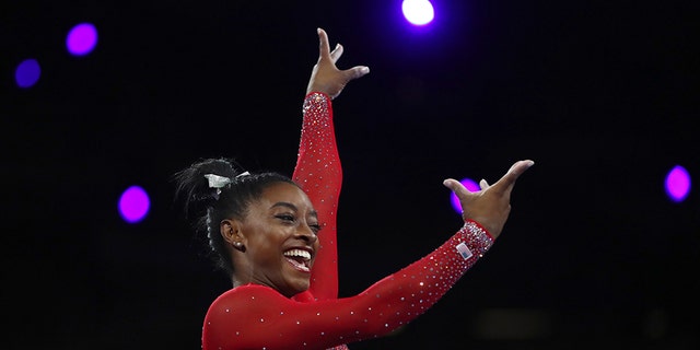 Gold medalist Simone Biles of the United States performs on the vault in the women's apparatus finals at the Gymnastics World Championships in Stuttgart, Germany, Saturday, Oct. 12, 2019. (AP Photo/Matthias Schrader)