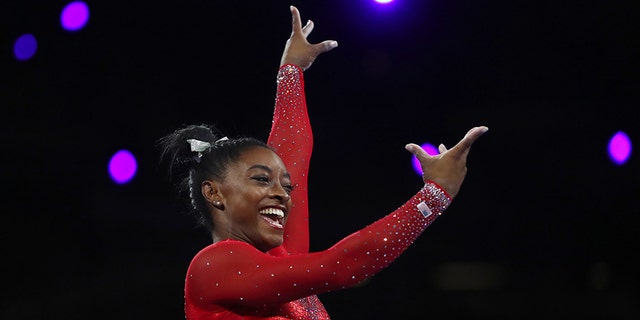 Gold medalist Simone Biles of the United States performs on the vault in the women's apparatus finals at the Gymnastics World Championships in Stuttgart, Germany, Saturday, Oct. 12, 2019. (AP Photo/Matthias Schrader)