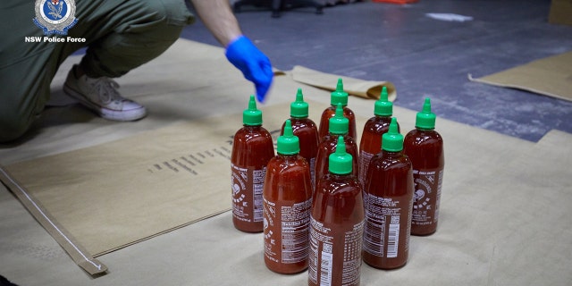 A 45-year-old man was arrested Thursday morning just outside a home in Edensor Park after task force agents with the NSW Police Force linked him to three other suspects arrested earlier this month in connection with a cargo shipment filled with 768 bottles of sriracha that contained “ice."