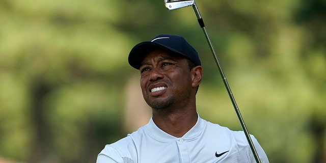 Tiger Woods of the United States watches his tee shot on the 5th hole during the second round of the Zozo Championship PGA Tour at the Accordia Golf Narashino country club in Inzai, east of Tokyo, Japan, Saturday, Oct. 26, 2019. (AP Photo/Lee Jin-man)