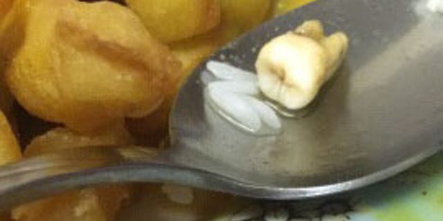 Stephanie McDonough shared pictures of the object, which the restaurant reportedly tried to claim was gristle, or a piece from the onion.