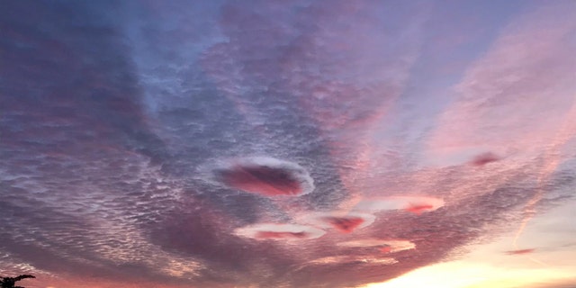 Incredible 'UFO-like' clouds over Gloucestershire as the sunrises over the West Country. October 28, 2019. (Credit: SWNS)