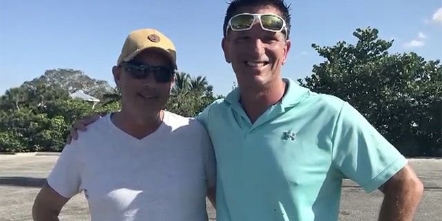 Good Samaritans Rob Goodman, left, and Ed Coster after rescuing a 81-year-old woman who spent 10 hours in the water in a nearly-submerged vehicle in Venice, Fla.
