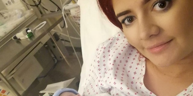 Lauren Middleton, 24, holding baby Archie after his birth.