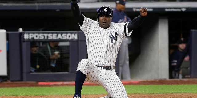 New York Yankees' Didi Gregorius reacts after scoring on a double by second baseman DJ LeMahieu (26) during the seventh inning of Game 1 of an American League Division Series baseball game against the Minnesota Twins, Friday, Oct. 4, 2019, in New York. (AP Photo/Seth Wenig)