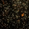 A Catalonian independence flag is waved as people hold up their phones with the flashlight switched on during a Catalan pro-independence protest in Barcelona, Spain, Oct. 20, 2019. 