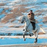 North Korean leader Kim Jong Un rides a white horse to climb Mount Paektu, North Korea, Oct. 16, 2019. 