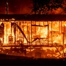 Flames consume a home as the Kincade Fire tears through the Jimtown community of Sonoma County, California, Oct. 24, 2019. 