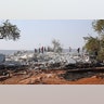 People look at the destroyed compound of Abu Bakr al-Baghdadi near the village of Barisha, in Idlib province, Syria, Oct. 27, 2019. 