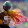 Shelly-Ann Fraser-Pryce, of Jamaica, celebrates after winning the gold medal in the women's 100-meter final at the World Athletics Championships in Doha, Qatar, Sept. 29, 2019. 
