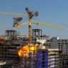Two unstable cranes at the collapsed Hard Rock Hotel come crashing down after being detonated for implosion in New Orleans, Oct. 20, 2019.