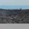 Fire crews walk along a blackened ridge as they battle the Getty fire in Los Angeles, Oct. 28, 2019.
