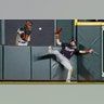Washington Nationals right fielder Adam Eaton can't get a glove on an RBI-double by Houston Astros' George Springer during the eighth inning of Game 1 of the World Series in Houston, Oct. 22, 2019. 