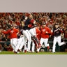 Washington Nationals' Yan Gomes and Daniel Hudson celebrate advancing to the World Series after defeating the St. Louis Cardinals in the National League Championship Series in Washington, Oct. 15, 2019.
