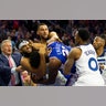 Joel Embiid of the Philadelphia 76ers fights with Karl-Anthony Towns of the Minnesota Timberwolves in the third quarter of their NBA game in Philadelphia, Oct. 30, 2019. 
