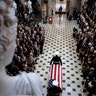 A military honor guard moves the casket Rep. Elijah Cummings into Statuary Hall at the U.S. Capitol in Washington, Oct. 24, 2019. 