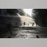 Anti-government protesters run amid the spray of a police water cannon during demonstrations against economic inequality in Santiago, Chile, Oct. 30, 2019. 