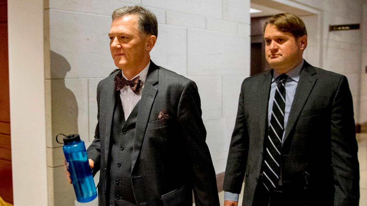 George Kent, left, on Capitol Hill last month. He testified that he was told to "lay low" on Ukraine policy as the Trump administration and the president's personal attorney Rudy Giuliani were interacting with Ukraine outside of traditional foreign policy channels.