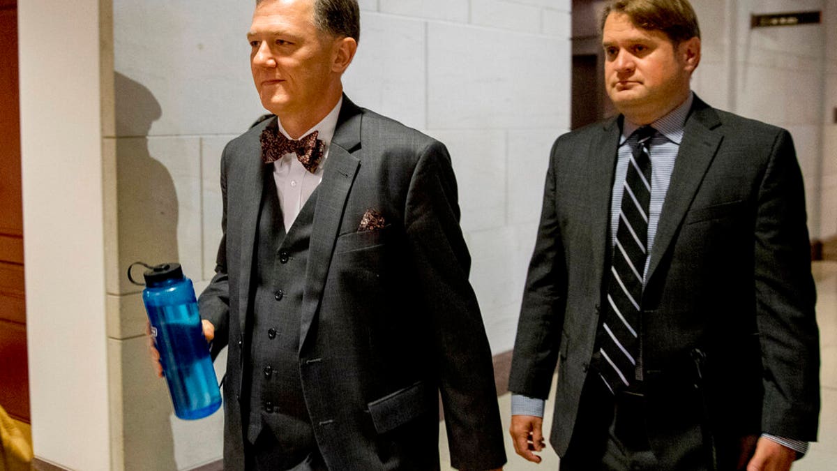 George Kent, left, on Capitol Hill last month. He testified that he was told to "lay low" on Ukraine policy as the Trump administration and the president's personal attorney Rudy Giuliani were interacting with Ukraine outside of traditional foreign policy channels.