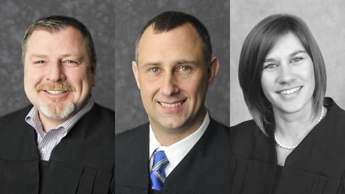 Judges Andrew Adams, left, Bradley Jacobs and Sabrina Bell have been suspended without pay, according to the Indiana Supreme Court. (Indiana Courts)