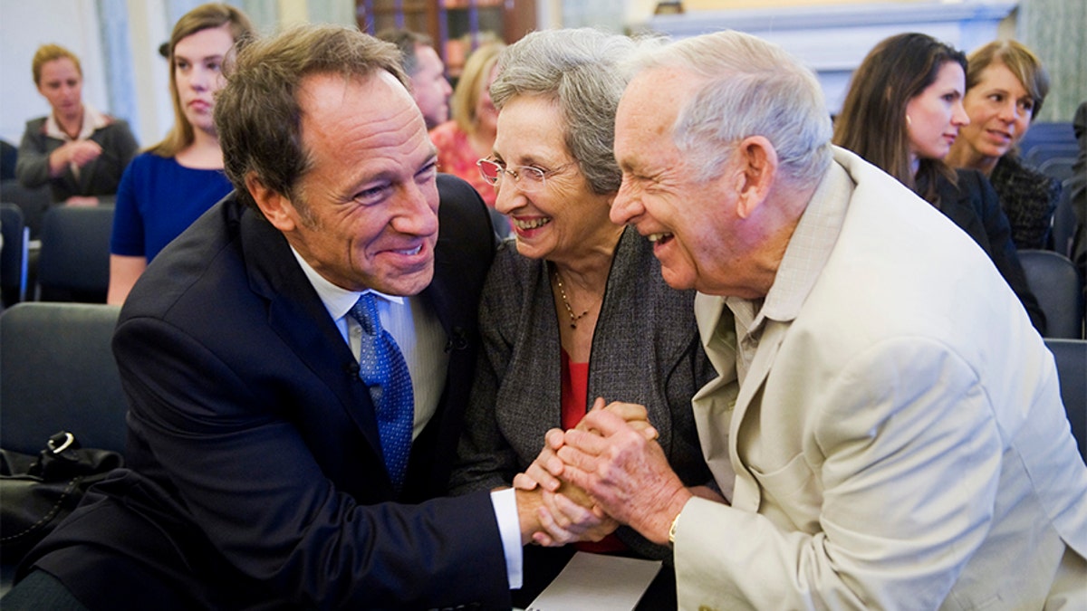 Mike Rowe, left, producer and host of Discovery Channel's "Dirty Jobs," shares a laugh with his parents John and Peggy Rowe, of Perry Hall, Md., before Mike testified at a Senate Commerce, Science, and Transportation Committee hearing in Russell Building entitled "Manufacturing Our Way to a Stronger Economy."  