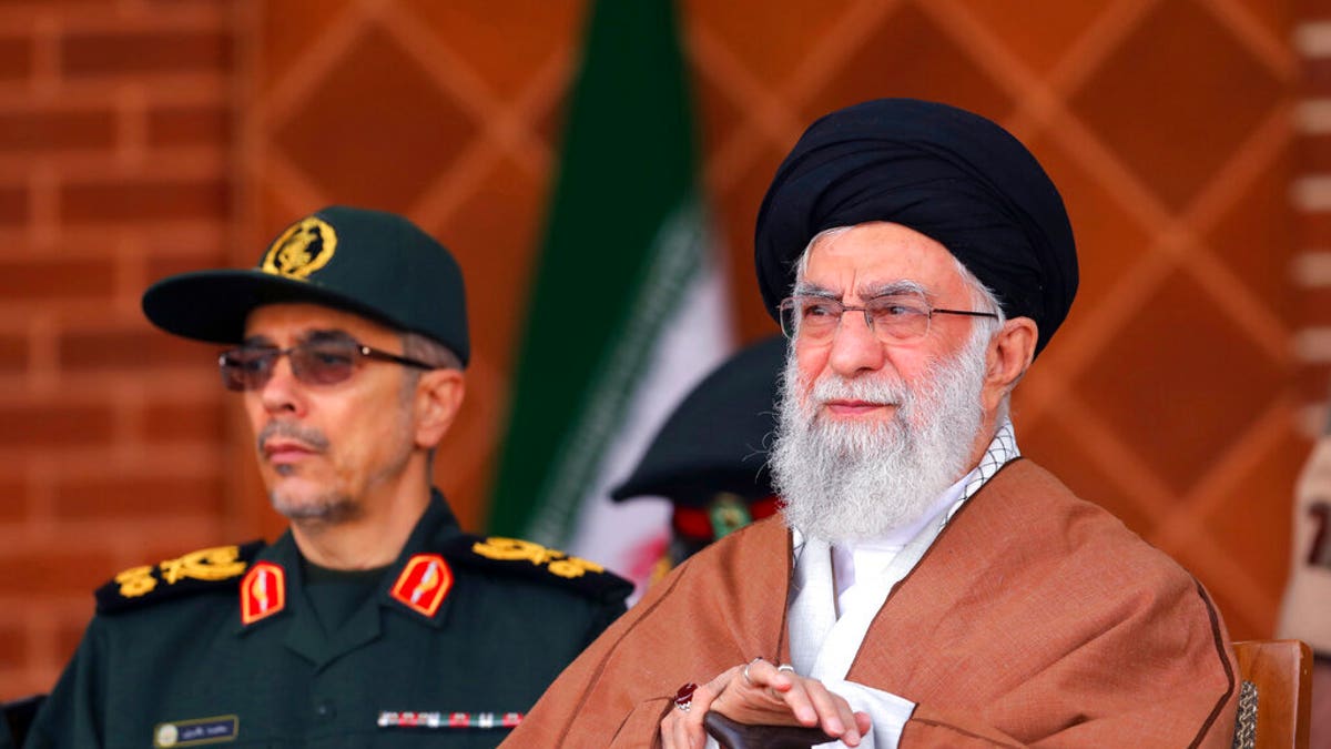 Supreme Leader Ayatollah Ali Khamenei reviews armed forces with Chief of the General Staff of the Armed Forces Gen. Mohammad Hossein Bagheri, during a graduation ceremony at Iran's Air Defense Academy, in Tehran, Iran, Wednesday, Oct. 30, 2019. 