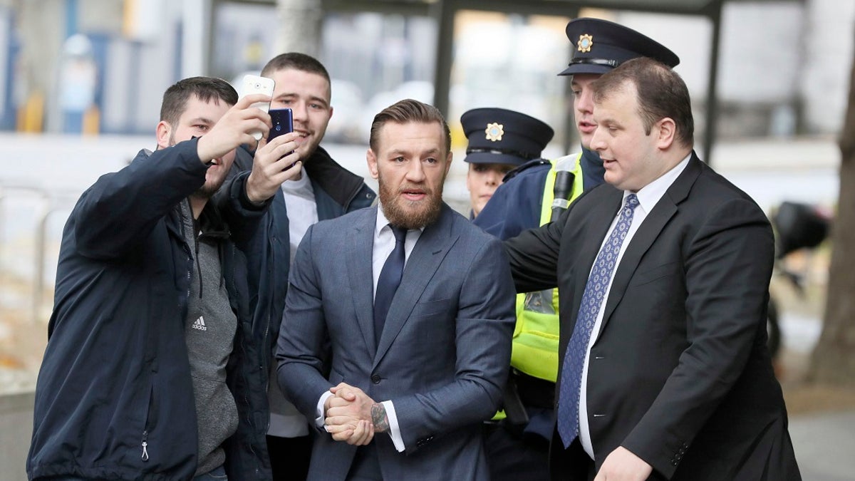 UFC fighter Conor McGregor arrives at the District Court where he pleaded guilty Friday to an assault charge after allegedly punching a man at a pub, in Dublin on Friday. (Brian Lawless/PA via AP)