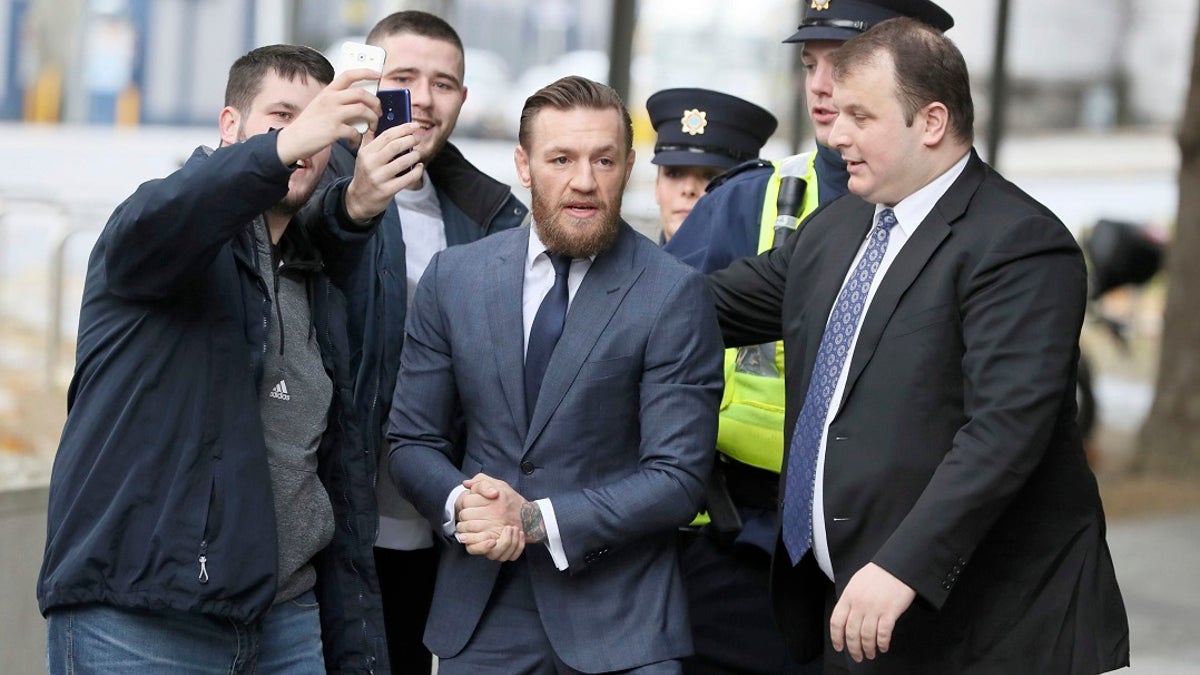 UFC fighter Conor McGregor arrives at the District Court where he pleaded guilty Friday to an assault charge after allegedly punching a man at a pub, in Dublin on Friday. (Brian Lawless/PA via AP)