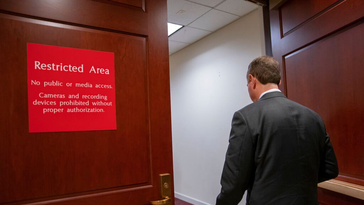 Rep. Adam Schiff, chairman of the House Intelligence Committee, returns to a secure area after speaking to reporters after witnesses defied a subpoena to appear before House impeachment investigators following President Donald Trump's orders not to cooperate with the probe, in Washington, Monday, Nov. 4, 2019. John Eisenberg, the lead lawyer for the National Security Council, and National Security Council aide Michael Ellis, were scheduled to testify early Monday but not appear. (AP Photo/J. Scott Applewhite)