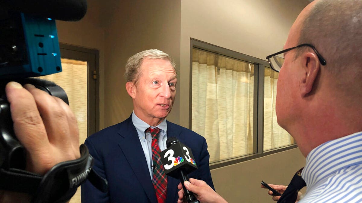 Democratic presidential candidate Tom Steyer speaks to reporters before hosting a town hall in Henderson, Nev., on Monday, Nov. 4, 2019. (AP Photo/Michelle L. Price)