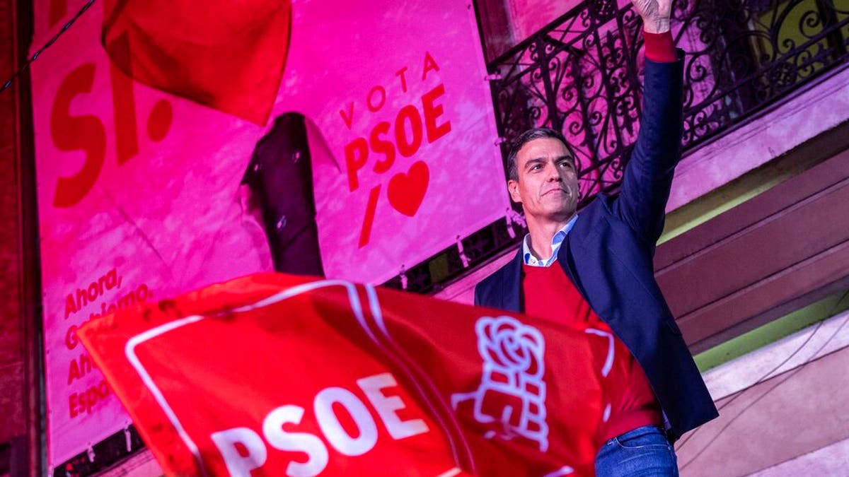Spain's Prime Minister and Socialist Party leader Pedro Sanchez gestures to supporters outside the party headquarters following the general election in Madrid.