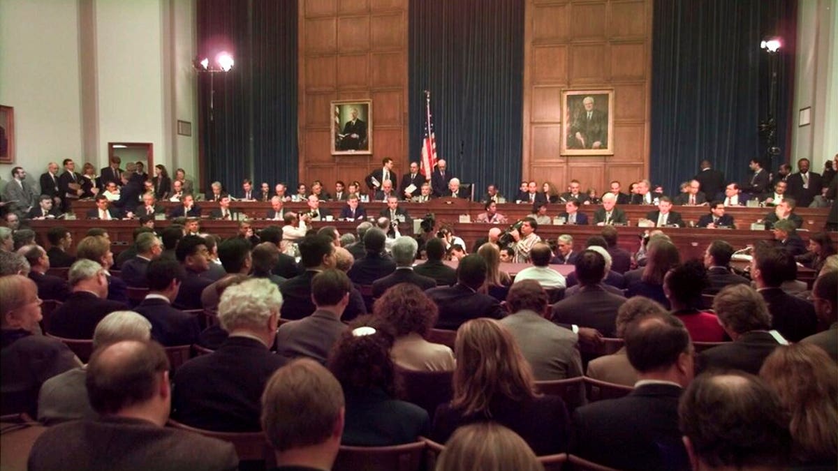 In this Nov. 19, 1998 file photo, House Judiciary Committee Chairman Henry Hyde, R-Ill., presided over the committee's impeachment hearing for President Clinton. (AP Photo/Joe Marquette, File)