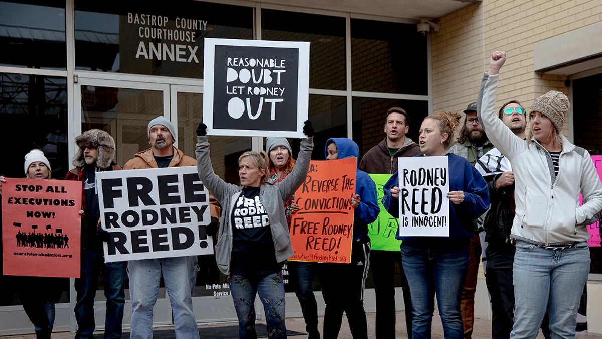 Protesters chant outside the Bastrop County courthouse this week. (Nick Wagner/Austin American-Statesman via AP)