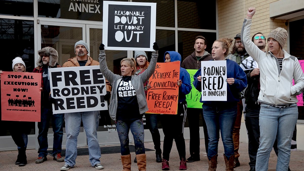 Protesters chant outside the Bastrop County courthouse this week. (Nick Wagner/Austin American-Statesman via AP)