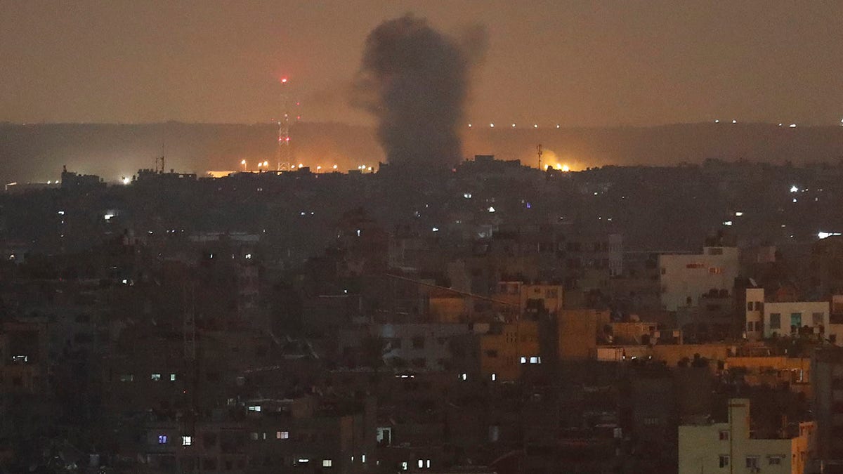 An explosion caused by Israeli airstrikes is seen in Gaza City, early Thursday, Nov. 14, 2019. (AP Photo/Adel Hana)