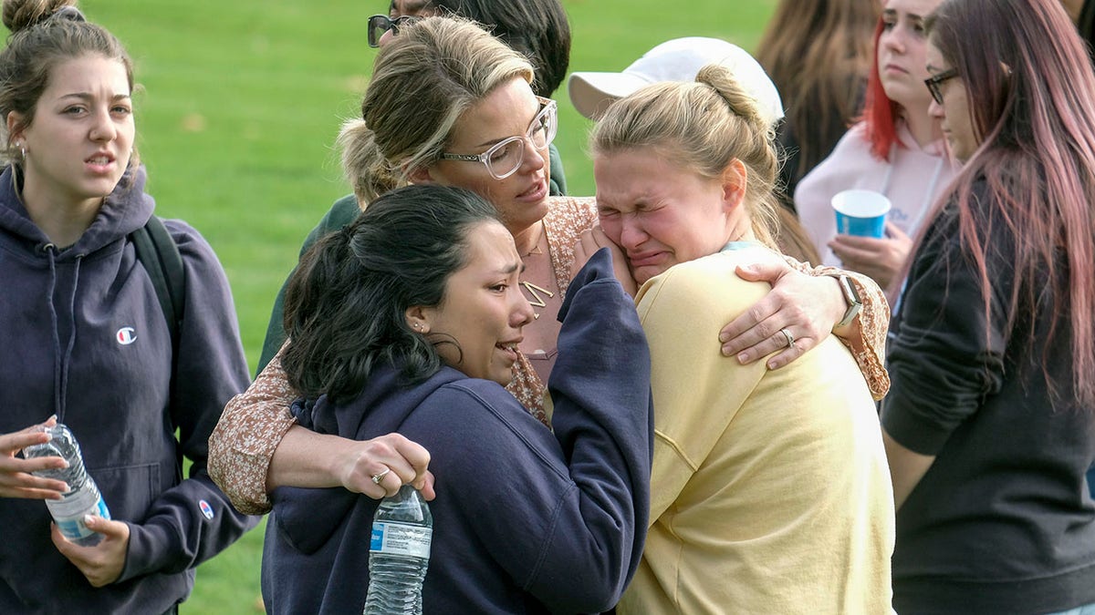 Students are comforted as they wait to be reunited with their parents following a shooting at Saugus High School that injured several people, Thursday, Nov. 14, 2019, in Santa Clarita, Calif. (Associated Press)
