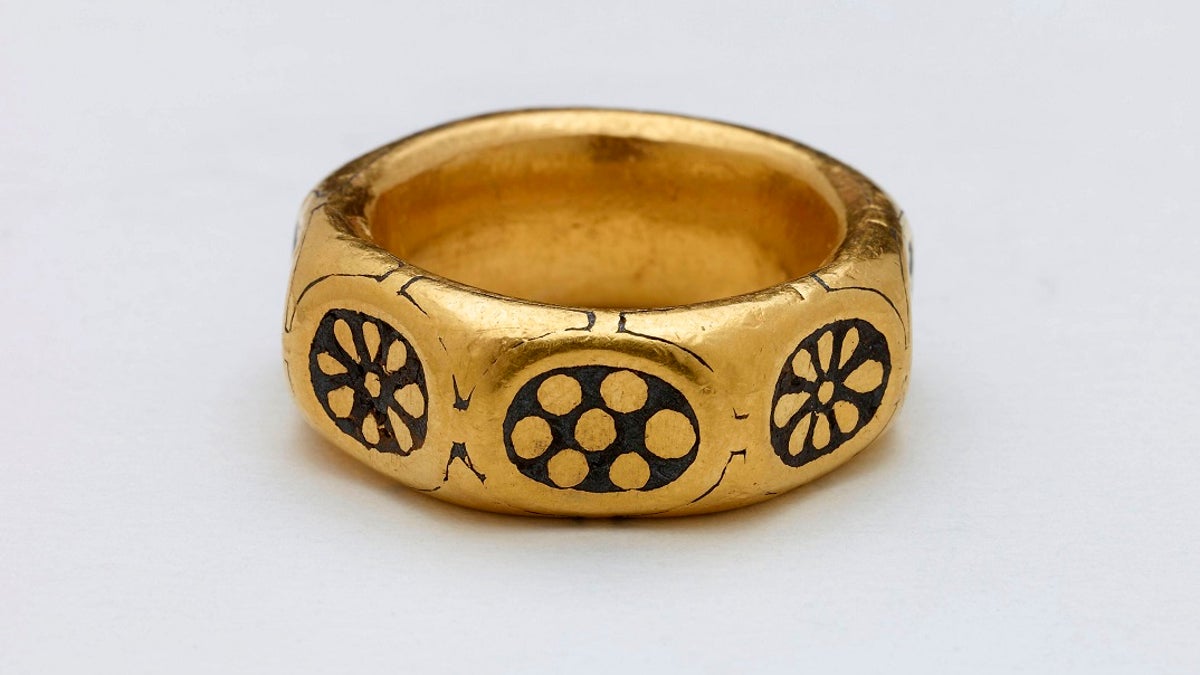 This undated handout photo provided by the British Museum shows a gold ring from the ninth century which was part of a million-dollar Viking hoard that metal detectorists George Powell and Layton Davies have been convicted of stealing. (British Museum via AP)
