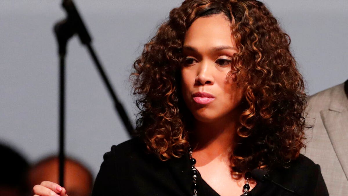 FILE - In this Oct. 23, 2019, file photo, Maryland State Attorney Marilyn Mosby, left, speaks during a viewing service for the late U.S. Rep. Elijah Cummings at Morgan State University in Baltimore. Three men incarcerated for 36 years in Maryland were exonerated Monday, Nov. 25, in the slaying of a Baltimore teenager after a review of their case. Mosby reopened the case earlier this year after one of the three men sent a letter to the Conviction Integrity Unit. (AP Photo/Julio Cortez, File)