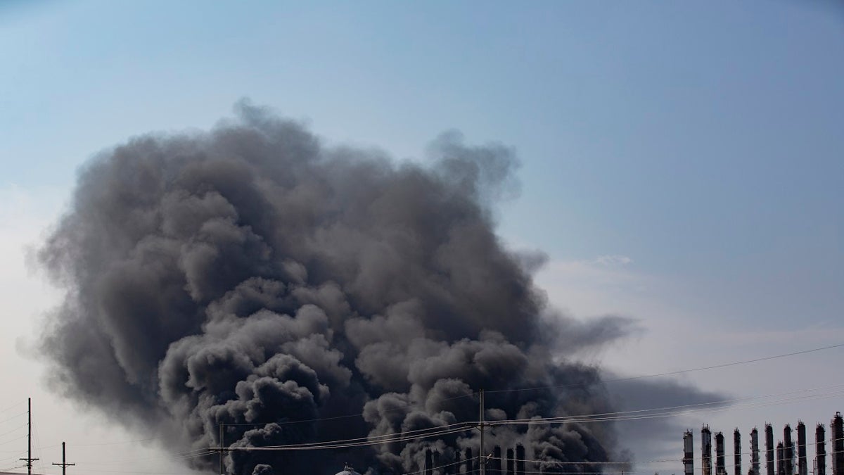 Smoke rises from an explosion at the TPC Group Port Neches Operations plant on Wednesday in Port Neches, Texas. (Marie D. De Jesus/Houston Chronicle via AP)