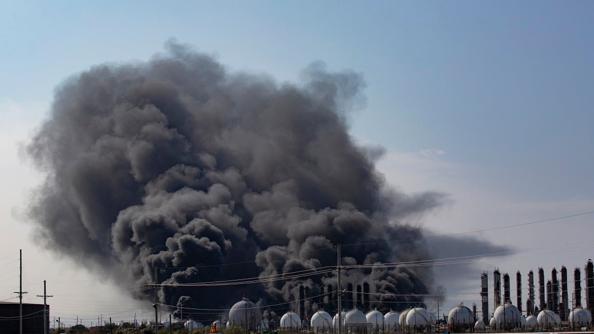 Smoke rises from an explosion at the TPC Group Port Neches Operations plant on Wednesday in Port Neches, Texas. (Marie D. De Jesus/Houston Chronicle via AP)