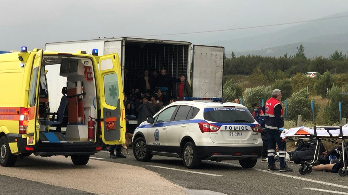 Migrants are seen inside a refrigerated truck found by police, after a check at a motorway near Xanthi, Greece, November 4, 2019.