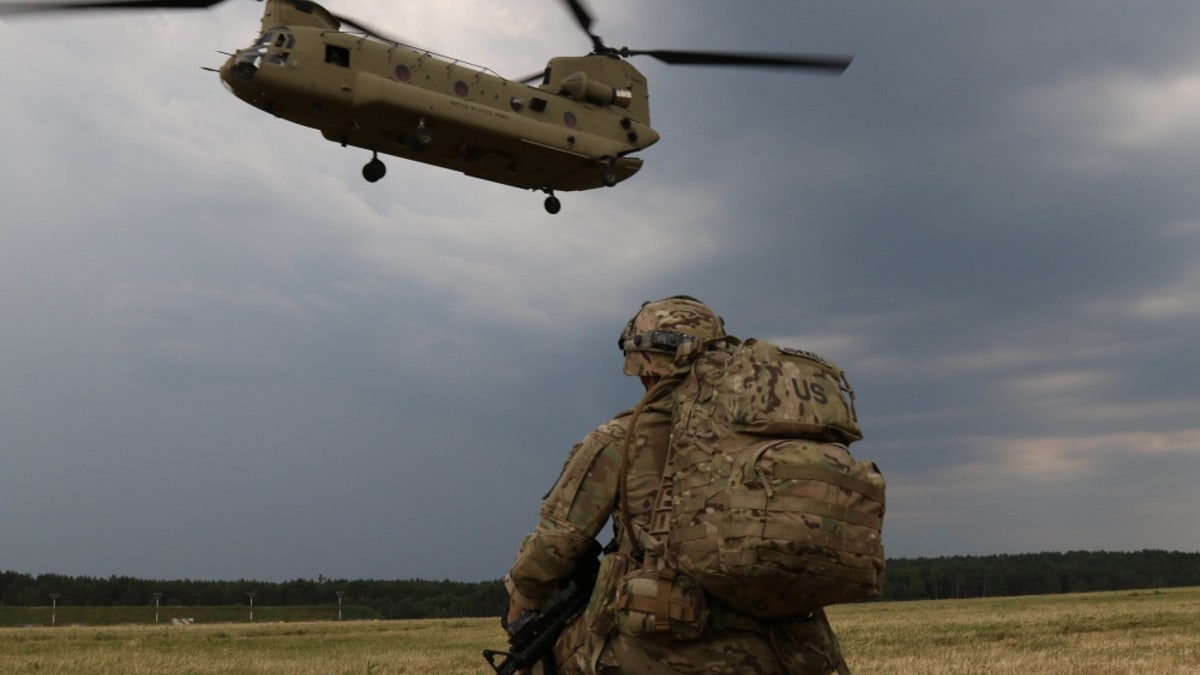 Capt. Gary Gorrel assigned to the 143rd Airborne Infantry Regiment from Texas, waits for his chinook to arrive, to conduct an air insertion exercise June, 10 2018, with members of the Israeli Defense Forces, the Italian Armed Forces and the Polish Army for exercise Swift Response. Exercise Swift Response 18 was a U.S. Army Europe-led multinational exercise held in Latvia, Lithuania and Poland - file photo.