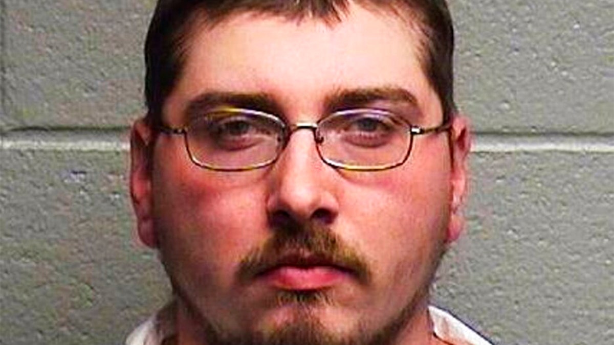 Brandon Ayscue, police say, is charged with assault with a deadly weapon after an argument over towing a vehicle early Friday in Durham, N.C. (AP/Durham Police Department)
