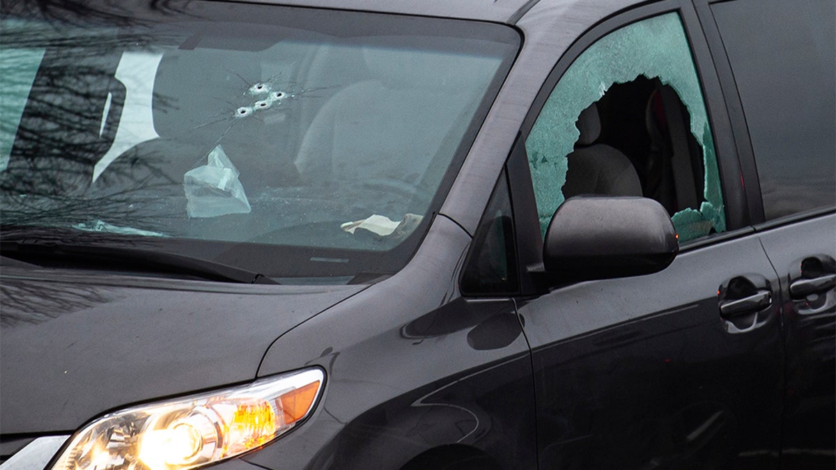 Bullet holes are seen here in the windows of a van in the parking lot of Sarah J. Anderson Elementary School in Vancouver, Wash., following a shooting on Tuesday, Nov. 26, 2019. Authorities say a man shot several people in a Vancouver, Wash., elementary school parking lot and then shot himself after a police chase.