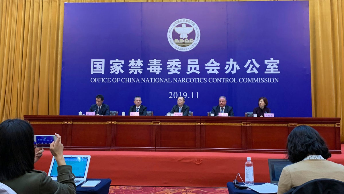 Chinese and U.S. enforcement officers hold a press conference on cracking down on fentanyl trafficking in Xingtai in northern China's Hebei province on Thursday, Nov. 7, 2019.