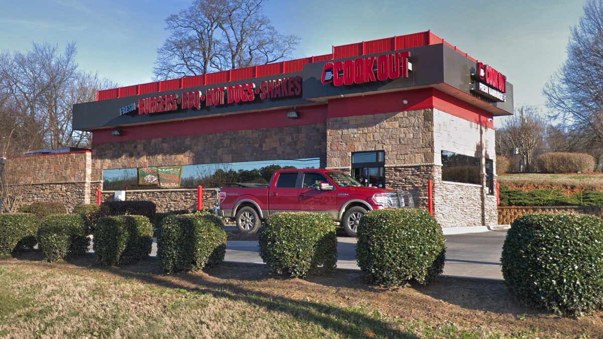 Taren Woods, a 10-year employee of Cook Out and the on-duty manager, claims she was fired after a cashier refused service to a police officer, even though the woman followed company policy by asking another cashier to take his order.