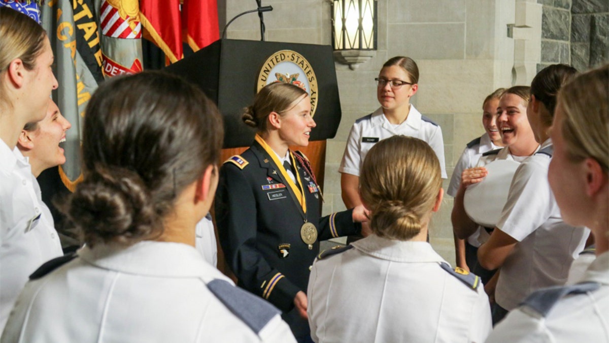 Heisler talks with members of the West Point Women's Soccer team after the award ceremony. (U.S. Army photo by Brandon O'Connor)