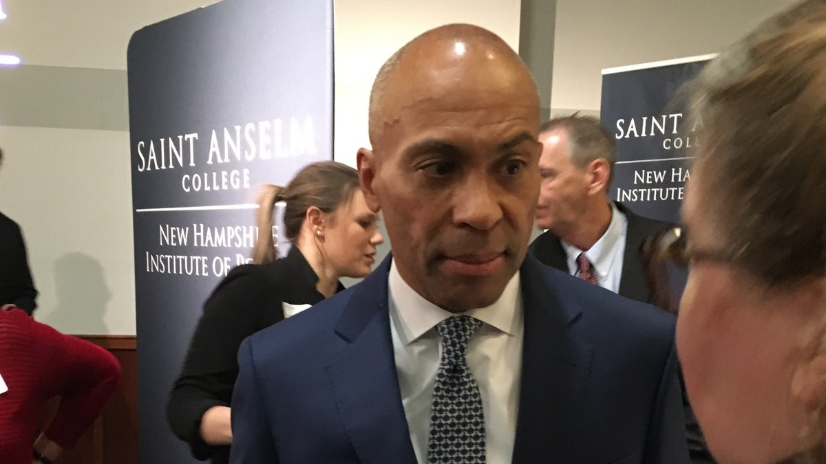 Newly declared Democratic presidential candidate and former Massachusetts Gov. Deval Patrick speaks with an audience member after headlining 'Politics and Eggs' at the New Hampshire Institute of Politics at Saint Anselm College in Manchester, NH on Nov. 25, 2019